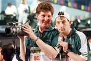 26 June 1999; Liz Callery, Sports Director with Special Olympics Ireland and Sean Berkley from Belfast, record some of the Opening Ceremony for the 1999 Special Olympics World Summer Games in Raleigh, North Carolina, USA. Photo by Ray McManus/Sportsfile