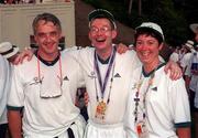 4 July 1999; Special Olympian John Blackburn from Newtown, Co Wexford who won a Gold Medal in the Shot Put pictured with swimming coaches Jimmy Goodall, left, from Enniscorthy,  Wexford and Frances O'Hagan from Ferns, Wexford at the Closing Ceremony of the 1999 Special Olympics World Summer Games in Raleigh, North Carolina, USA. Photo by Ray McManus/Sportsfile