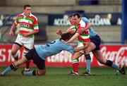 13 January 2001; Dave Lyons of Bective Rangers is tackled by David Blaney, left, and Niall Breslin of UCD during the AIB All-Ireland League Division 2 match between Bective Rangers and UCD at Donnybrook Stadium in Dublin. Photo By Brendan Moran/Sportsfile