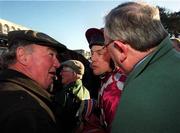 14 January 2001; Trainer Pat Hughes, left, and Paddy Monaghan, congratulate jockey Charlie Swan, after he won the Pierse Hurdle Handicap on Grinkov during Horse Racing from Leopardstown Racecourse in Dublin. Photo By Brendan Moran/Sportsfile