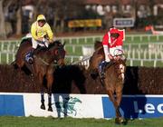 14 January 2001; Micko's Dream, with Ruby Walsh up, right, clears the last alongside Nuzum Road Makers, with Kieran Gaule up, on their way to winning the Pierse Leopardstown Handicap Steeplechase during Horse Racing from Leopardstown Racecourse in Dublin. Photo By Brendan Moran/Sportsfile