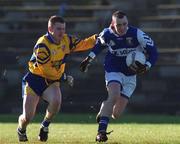 14 January 2001; Paul Dunne of Laois is tackled by David Hannify of Longford during the O'Byrne Cup First Round match between Longford and Laois at Pearse Park in Longford. Photo by Aoife Rice/Sportsfile