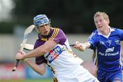 25 July 2009; Diarmuid Lyng, Wexford, in action against Garrie O'Connor, Clare. GAA Hurling All-Ireland Senior Championship Relegation, Round 1, Clare v Wexford, O'Moore Park, Portlaoise, Co. Laois. Picture credit: Matt Browne / SPORTSFILE