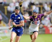 25 July 2009; Niall Gilligan, Clare, in action against Malachy Travers, Wexford. GAA Hurling All-Ireland Senior Championship Relegation, Round 1, Clare v Wexford, O'Moore Park, Portlaoise, Co. Laois. Picture credit: Matt Browne / SPORTSFILE