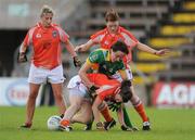 26 July 2009; Katie O'Brien, Meath, in action against Laura Brown, left, Maebh Moriarty, right, and Rhona McKeever, front, Armagh. TG4 All-Ireland Ladies Football Senior Championship Qualifier, Round 1, Armagh v Meath, Kingspan Breffni Park, Cavan. Picture credit: Pat Murphy / SPORTSFILE