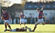 7 November 2015; Rob Keogh, Clontarf, kicks a penalty, held by Michael Noone. Clontarf Rugby Club, Castle Avenue, Clontarf, Dublin 3. Picture credit: Ramsey Cardy / SPORTSFILE