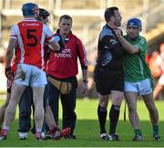 8 November 2015; Brian Carroll, Coolderry, is restrained by referee David Hughes after being shown a red card. AIB Leinster GAA Senior Club Hurling Championship Quarter-Final, Coolderry v Cuala. O'Connor Park, Tullamore, Co. Offaly. Picture credit: Ramsey Cardy / SPORTSFILE