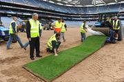 28 July 2009; In attendance as the first of the new sod are placed at Croke Park ahead of this weekend's GAA Football All-Ireland Championship Quarter Finals are Uachtaran Chumann Luthchleas Gael Criostoir O Cuana, Stadium Director Peter McKenna and Richard Hayden, STRI (Sports Turf Research Institute). Croke Park, Dublin. Picture credit: Ray McManus / SPORTSFILE