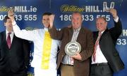 29 July 2009; An Taoiseach Brian Cowen T.D. watches on as jockey Andrew McNamara, owner Cathal McGovern and trainer Colin McBratney, right, celebrate winning the William Hill Galway Plate with Ballyholland. Galway Racing Festival - Wednesday, Ballybrit, Galway. Picture credit: Stephen McCarthy / SPORTSFILE