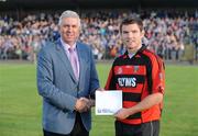 29 July 2009; Mark Landers, Cappoquin, receives his prize for winning the Bord Gais Energy Crossbar Challenge from Ger Cunningham of Bord Gais Energy at half-time in the Bord Gais Energy GAA Munster U21 Hurling Championship Final between Waterford and Clare, Fraher Field, Dungarvan, Co Waterford. Picture credit: Matt Browne / SPORTSFILE