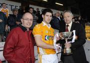 29 July 2009; Stiofain MacDhaibhead, Bord Gais Energy, left, and Martin McAviney, Ulster Council GAA, right, present the Bord Gais Energy Ulster U21 cup to Antrim Captain Cormac Donnelly. Bord Gais Energy GAA Ulster U21 Hurling Championship Final, Antrim v Derry, Casement Park, Belfast, Co. Antrim. Picture credit: Oliver McVeigh / SPORTSFILE