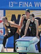 30 July 2009; Members of Ireland's 4 x 200m Freestyle Relay team, from left, Melanie Nocher, from Hollywood, Co. Down, Clare Dawson, from Hollywood, Co. Down, and Niamh O'Sullivan, from Tralee, Co. Kerry, keep an eye on the scoreboard as team-mate Nuala Murphy performs in the final leg of Heat 3 of the Women's 4 x 200m Freestyle Team Relay. Ireland finished in a time of 8:09.34 breaking the Irish Senior Record by 9 seconds and finishing 15th overall. FINA World Swimming Championships Rome 2009, Foro Italico, Rome, Italy. Picture credit: Brian Lawless / SPORTSFILE