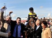 30 July 2009; Jockey Stephen Gray and winning connections celebrate after Bahrain Storm won the Arthur Guinness Galway Hurdle Handicap. Galway Racing Festival - Thursday, Ballybrit, Galway. Picture credit: Stephen McCarthy / SPORTSFILE