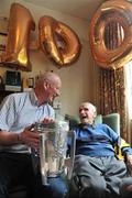 31 July 2009; Martin White, the oldest All-Ireland hurling medal winner still alive, was joined for his 100th birthday celebrations by Kilkenny manager Brian Cody, with the Liam MacCarthy cup, at his Dublin home in Glasnevin. Martin won Senior All-Ireland hurling medals with Kilkenny in 1932, 1933 & 1935. Picture credit: David Maher / SPORTSFILE
