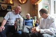31 July 2009; Martin White, the oldest All-Ireland hurling medal winner still alive, was joined for his 100th birthday celebrations by Kilkenny manager Brian Cody, left, with the Liam MacCarthy cup, and Kilkenny hurler Tommy Walsh at his Dublin home in Glasnevin. Martin won Senior All-Ireland hurling medals with Kilkenny in 1932, 1933 & 1935. Picture credit: David Maher / SPORTSFILE