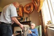 31 July 2009; Martin White, the oldest All-Ireland hurling medal winner still alive, holds the Liam MacCarthy cup with Kilkenny manager Brian Cody who joined him for his 100th birthday celebration at his Dublin home in Glasnevin. Martin won Senior All-Ireland hurling medals with Kilkenny in 1932, 1933 & 1935. Picture credit: David Maher / SPORTSFILE
