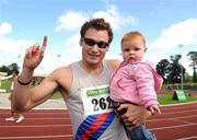 1 August 2009; David Gillick, Dundrum South Dublin A.C., celebrates with his niece and godchild Catlin Gillick, age 9 months, after winning the Men's 200m Final. Woodie's DIY / AAI National Senior Track & Field Championships - Saturday. Morton Stadium, Santry, Dublin. Picture credit: Stephen McCarthy / SPORTSFILE