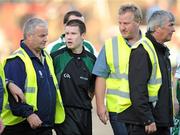 1 August 2009; Referee Padraig Hughes is escorted off the field by stewards after the game. GAA Football All-Ireland Senior Championship Qualifier, Round 4, Meath v Limerick, O'Moore Park, Portlaoise, Co. Laois. Picture credit: Matt Browne / SPORTSFILE