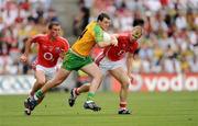 2 August 2009; Micheal Murphy, Donegal, in action against Patrick Kelly, left, and Michael Shields, Cork. GAA Football All-Ireland Senior Championship Quarter-Final, Cork v Donegal, Croke Park, Dublin. Picture credit: Ray McManus / SPORTSFILE
