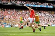 2 August 2009; Paul Kerrigan, Cork, shoots to score his side's first goal goal despite the attention of Barry Dunnion, Donegal. GAA Football All-Ireland Senior Championship Quarter-Final, Cork v Donegal, Croke Park, Dublin. Picture credit: Stephen McCarthy / SPORTSFILE