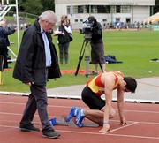 2 August 2009; Race official Christy Wall checks Brian Gregan, Tallaght AC, on the starting blocks in the Men's 400m Final. Woodie's DIY / AAI National Senior Track & Field Championships. Morton Stadium, Santry, Dublin. Picture credit: Brendan Moran / SPORTSFILE