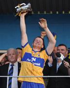 29 July 2009; Clare captain Ciaran O'Doherty lifts the cup alongside Jimmy O'Gorman, right, Munster Council and John Mullins, CEO Bord Gais Energy. Bord Gais Energy GAA Munster U21 Hurling Championship Final, Waterford v Clare, Fraher Field, Dungarvan, Co Waterford. Picture credit: Matt Browne / SPORTSFILE