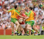 2 August 2009; Pearse O'Neill, Cork, is surrounded by Donegal players Barry Monaghan, 6, David Walsh, Rory Kavanagh and Conal Dunne, left. GAA Football All-Ireland Senior Championship Quarter-Final, Cork v Donegal, Croke Park, Dublin. Picture credit: Ray McManus / SPORTSFILE