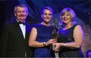 14 November 2015; Briege Corkery, centre, Cork, is presented with her All Star award by Marie Hickey, President, LGFA, in the company of Pól O Gallchóir, Ceannsaí, TG4. 2015 LGFA TG4 Ladies Football Allstar Awards, CityWest Hotel, Saggart, Co. Dublin. Picture credit: Brendan Moran / SPORTSFILE