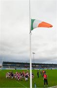 15 November 2015; The Clara team warm up as the Tricolour flies at half-mast in honour of the victims of the recent tragic events in Paris and the current period of national mourning in France. AIB Leinster GAA Senior Club Hurling Championship, Semi-Final, Cuala v Clara. Parnell Park, Dublin. Picture credit: Ray McManus / SPORTSFILE