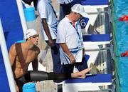 28 July 2009; Michael Phelps, USA, prepares alongside a swimming official for Heat 8 of the Men's 200m Butterfly. Phelps qualified for the final with a time of 1:54.35. FINA World Swimming Championships Rome 2009, Foro Italico, Rome, Italy. Picture credit: Brian Lawless / SPORTSFILE