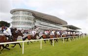 27 July 2009; The runners and riders pass grandstand during the Ghotel.ie & Hotelmeyrick.ie Novice Hurdle. Galway Racing Festival, Ballybrit, Galway. Picture credit: Stephen McCarthy / SPORTSFILE