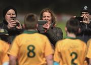 14 March 2015;    One for the digital library. Parents take pictures of their young footballers after their half-time exhibition game in Navan. The main event, between Meath and Laois, ends in a dramatic draw.    Photo by Sportsfile    This image may be reproduced free of charge when used in conjunction with a review of the book &quot;A Season of Sundays 2015&quot;. All other usage © SPORTSFILE