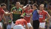 5 July 2015;    'You've got to be kidding ref'. Mark Collins of Cork, third from right, reacts with utter disbelief to referee Pádraig Hughe's decision to award Kerry a penalty in the counties' Munster final draw.    Picture credit: Brendan Moran / SPORTSFILE    This image may be reproduced free of charge when used in conjunction with a review of the book &quot;A Season of Sundays 2015&quot;. All other usage © SPORTSFILE