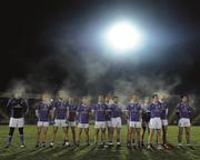 21 January 2015;    Schmoking. The Cavan players raise the ambient temperature in Breffni Park as they stand for Amhrán na bhFiann before pipping Fermanagh by a point.    Picture credit: Barry Cregg / SPORTSFILE    This image may be reproduced free of charge when used in conjunction with a review of the book &quot;A Season of Sundays 2015&quot;. All other usage © SPORTSFILE