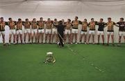 6 September 2015;    Kilkenny backs to the wall - a novel experience. Rackard Coady, the Kilkenny kit man, places streamers on the victorious players. Even in the dressing room, there is an aura about the black and amber.    Picture credit: Ray McManus / SPORTSFILE    This image may be reproduced free of charge when used in conjunction with a review of the book &quot;A Season of Sundays 2015&quot;. All other usage © SPORTSFILE