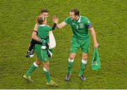 16 November 2015; Republic of Ireland captain John O'Shea 'high fives' Teigan, the 5 year old daughter of Shane Long, as they celebrate after the game. UEFA EURO 2016 Championship Qualifier, Play-off, 2nd Leg, Republic of Ireland v Bosnia and Herzegovina. Aviva Stadium, Lansdowne Road, Dublin. Picture credit: Brendan Moran / SPORTSFILE