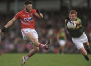 8 March 2015;    Airborne for a calcium test. Johnny Buckley's bones stand up to the strain of Eoin Cadogan's attempted clearance. Kerry endure a chastening day by the Lee against a rampant Cork.    Picture credit; Eoin Noonan / SPORTSFILE    This image may be reproduced free of charge when used in conjunction with a review of the book &quot;A Season of Sundays 2015&quot;. All other usage © SPORTSFILE