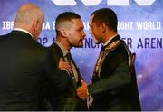 18 November 2015; Carl Frampton, centre, IBF Champion, is held back by promoter Barry McGuigan, as he exchange words with Scott Quigg, WBA Champion, during an IBF and WBA World Super Bantamweight unification clash press conference. Europa Hotel, Belfast, Co. Antrim. Picture credit: Oliver McVeigh / SPORTSFILE
