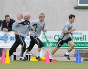 9 August 2009; Republic of Ireland manager Giovanni Trapattoni runs alongside Andy Keogh and Liam Miller, right, during squad training ahead of their international friendly against Australia on Wednesday. Republic of Ireland Squad Training, St. Michael's FC, Co. Tipperary. Picture credit: Diarmuid Greene / SPORTSFILE