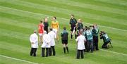 9 August 2009; Mayo captain Trevor Mortimer, Meath captain for the day, Eoghan Harrington, umpires, linesmen and photographers watch as referee Joe McQuillan tosses the coin before the game. GAA Football All-Ireland Senior Championship Quarter-Final, Meath v Mayo, Croke Park, Dublin. Picture credit: Daire Brennan / SPORTSFILE