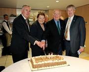 9 August 2009; Former GAA President and Mayo footballer Dr. Mick Loftus cuts a cake presented to him on the occasion of his 80th birthday with his wife Eidie, Uachtarán Chumann Lúthchleas Gael Criostóir Ó Cuana, left, and Ard Stiúrthoir Paraic Duffy, right. Dr. Mick Loftus Celebrates 80th Birthday, Croke Park, Dublin. Picture credit: Ray McManus / SPORTSFILE