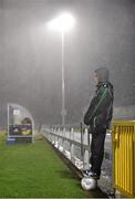 18 November 2015; Ballboy Lee O'Gorman, from Limerick City, looks on during heavy rainfall in the second half. UEFA U19 Championships Qualifying Round, Group 1, Republic of Ireland v Scotland.  The Marketsfield, Limerick. Picture credit: Diarmuid Greene / SPORTSFILE