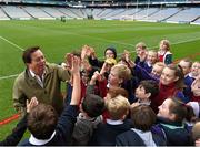 20 November 2015; RTE Gaelic Games correspondent Marty Morrissey meets students from Lattin, Co Tipperary, who were on a Croke Park Stadium tour, while waiting on an interview, following a press conference ahead of the EirGrid International Rules clash between Ireland and Australia at Croke Park, Dublin. Picture credit: Stephen McCarthy / SPORTSFILE