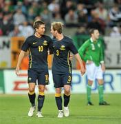 12 August 2009; David Carney, 3, Australia, celebrates after scoring his side's third goal with his team-mate Harry Kewell as Republic of Ireland's John O'Shea looks on. International Friendly, Republic of Ireland v Australia, Thomond Park, Limerick. Picture credit: David Maher / SPORTSFILE