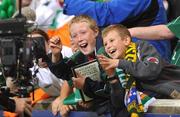 12 August 2009; Two young Republic of Ireland fans are filmed by a TV cameraman during the game. International Friendly, Republic of Ireland v Australia, Thomond Park, Limerick. Picture credit: Diarmuid Greene / SPORTSFILE