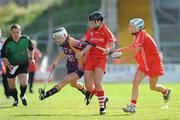 15 August 2009; Kate Kelly, Wexford, in action against Gemma O'Connor and Lynda O'Connell, Cork. Gala All-Ireland Senior Camogie Championship Semi-Final, Cork v Wexford, Nowlan Park, Kilkenny. Picture credit: Matt Browne / SPORTSFILE