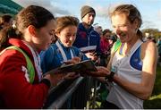 22 November 2015; Fionnuala McCormack, Kilcoole A.C., signs autographs for young fans after winning the Senior Women's event. GloHealth National Cross Country Championships, Santry Demesne, Dublin. Picture credit: Cody Glenn / SPORTSFILE