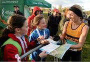 22 November 2015; Lizzie Lee, Leevale A.C., signs autographs for young fans after finish second in the Senior Women's event. GloHealth National Cross Country Championships, Santry Demesne, Dublin. Picture credit: Cody Glenn / SPORTSFILE