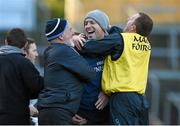 22 November 2015; Na Piarsaigh manager Shane O'Neill celebrates with his father, and team kitman, Mick O'Neill, left, and selector Kieran Bermingham, right, after victory over Ballygunner. AIB Munster GAA Senior Club Hurling Championship Final, Ballygunner v Na Piarsaigh. Semple Stadium, Thurles, Co. Tipperary. Picture credit: Diarmuid Greene / SPORTSFILE