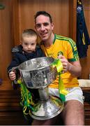 22 November 2015; South Kerry's Declan O'SullEvan and his son Ollie with the Bishop Moynihan Cup. Kerry County Senior Football Championship Final Replay, South Kerry v Killarney Legion. Fitzgerald Stadium, Killarney, Co. Kerry. Picture credit: Stephen McCarthy / SPORTSFILE
